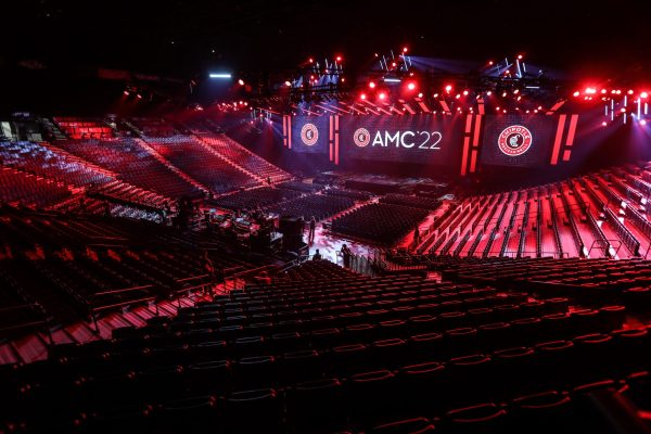 Wide shot of the ballroom arena with Chipotle AMC on screen